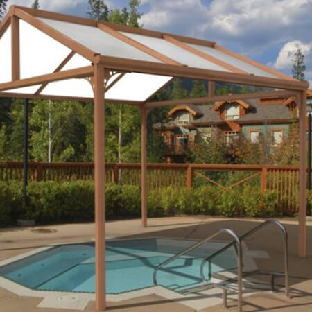 SW Plastic Canopies. A free standing canopy covering a swimming pool.