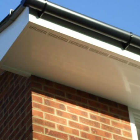 SW Plastic Roof Lines. White uPVC fascia & soffits on a brown brick house.